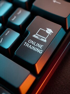 Online training button on a modern black computer keyboard for corporate education and e-learning concepts