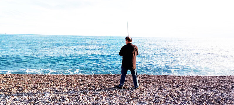 Man fishing on the beach during fishing season