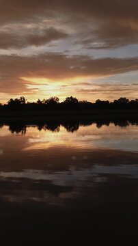 Beautiful Full Sunrise over Water Timelapse 4K Vertical Video