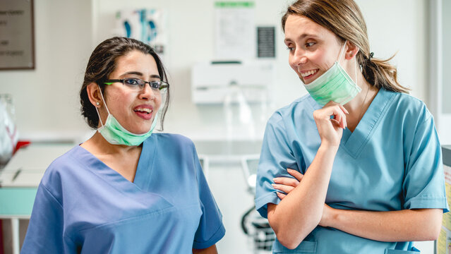 Smiling healthcare professionals in scrubs
