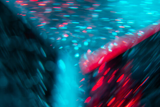 Abstract red and cyan light trail in dark cyberspace