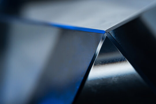 Abstract close-up of folded metallic geometric surface