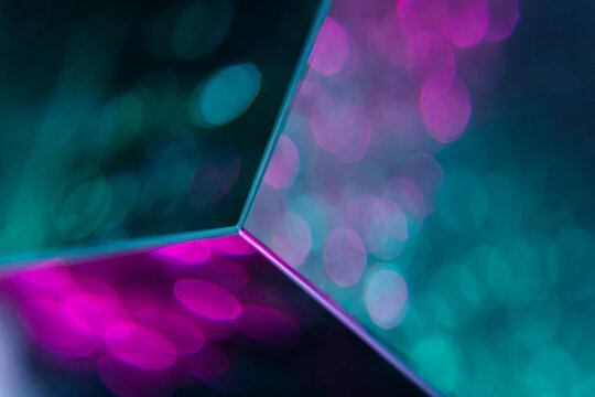 Abstract cube edge with teal and magenta bokeh light