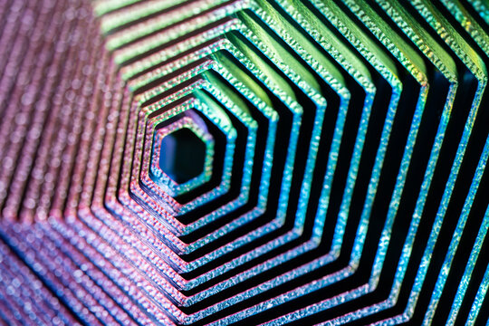 Abstract iridescent hexagonal pattern with geometric tunnel