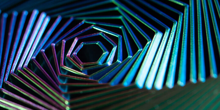 Iridescent geometric metal spiral with neon reflections
