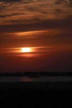 Vertical Timelapse of Red Sunset Over the Sea