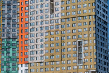 Modern architecture shines in the vibrant and diverse building facades of a bustling urban area on a sunny day © beholdereye