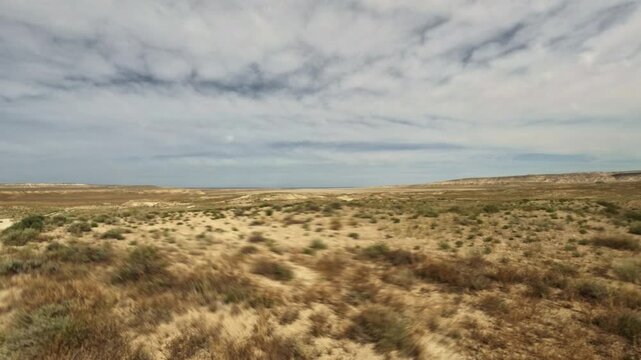 Camera moving forward along a desert dirt track
