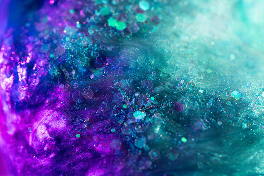 Abstract turquoise and purple hexagonal glitter background