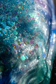 Iridescent hexagonal glitter texture in translucent resin