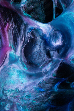 Abstract blue and purple fluid texture with glitter details