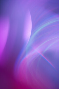 Abstract purple light waves with glowing ethereal texture