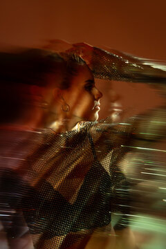 Female dancer in motion with dramatic motion blur