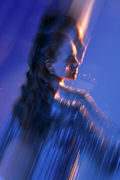 Defocused abstract motion blur portrait of a woman