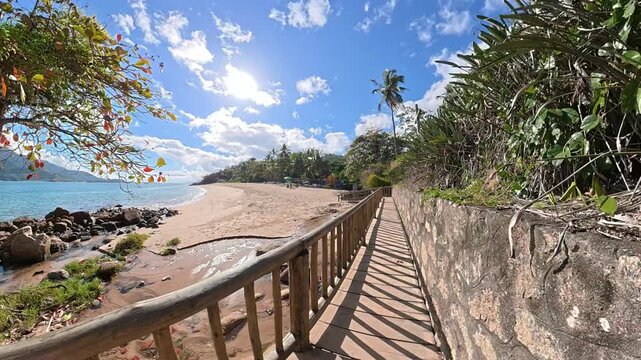 First Person Walking Along a Tropical Path to Feiticeira Beach in Ilhabela, Brazil