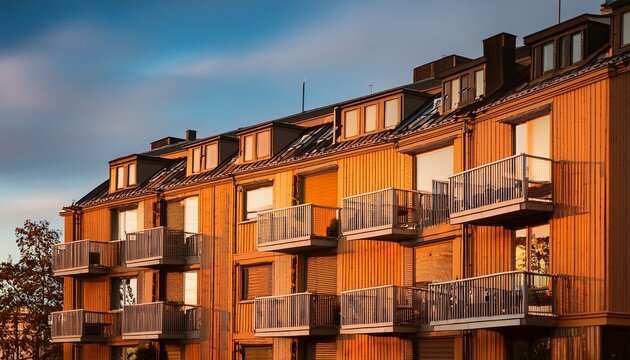 warm toned architecture with rhythmic housing balconies defining an urban zone of contemporary sweden stockholm stora ursvik enriched by residential facade contrast