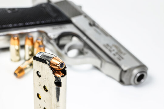 bullet .380 APC or 9mm Kurz JHP ( Jacketed Hollow Point ) Shell Shock Technologies ( NAS3 ) in magazines and and PPKs gun in background.