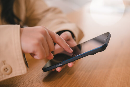 Social media marketing concept. Young Women hand using smartphone typing, chatting conversation in chat box icons pop up