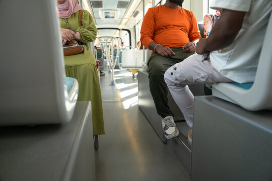 A subway car with people. An empty car.