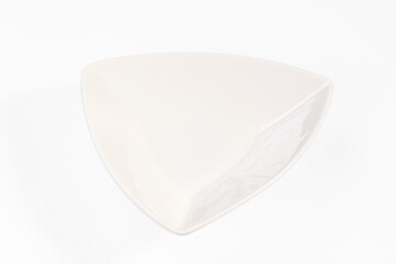 White triangular ceramic bowl on clean white background with soft shadow and glossy finish