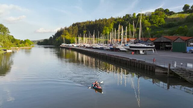 Women in a kayak on the River Dart in Totnes from a drone, Devon, England