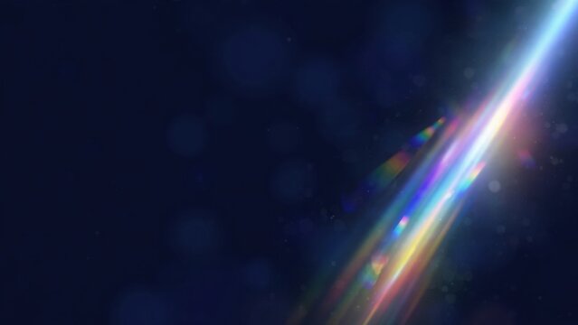 Diagonal beam of vibrant light refracts into rainbow hues against a dark, bokeh-filled backdrop