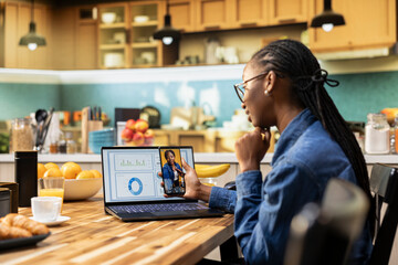 Remote worker watches social media videos on a mobile app at home, browsing short live content and...