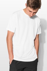 Obraz premium Young man in plain white t-shirt with hands in pockets