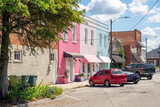 A small street of colorful historic storefronts in the vibrant downtown of the small town of Lake City, South Carolina, Pee Dee region.
