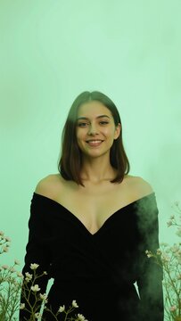 Serene Woman in Black on Mint Background
