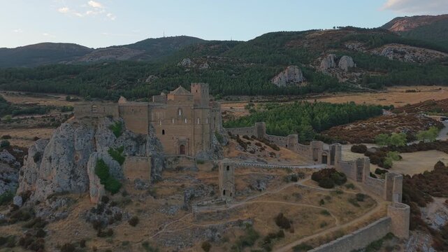 Aerial push in flying over medieval Loarre Castle in Huesca Spain