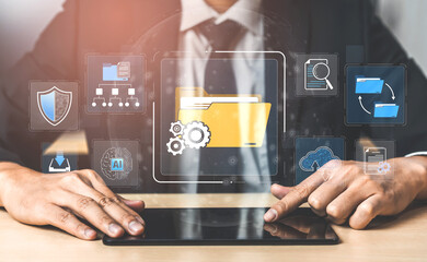Business Professional Using Tablet with Floating Digital Icons Representing Data Management, Information Technology and Cloud Storage Solutions Sigmoid © InfiniteFlow