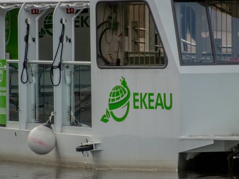 Ottawa, Ontario, Canada. Sep 9, 2026. Close-up view of EKEAU electric tour boat logo on white hull docked on water along Rideau Canal.