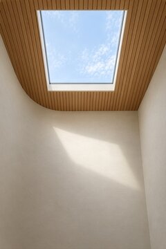 木ルーバー天井と天窓から自然光が差し込む現代住宅の室内