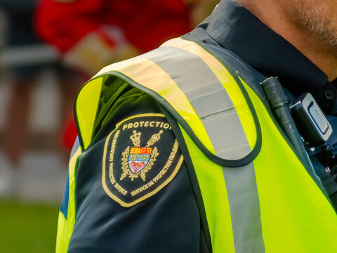 Ottawa, Ontario, Canada. Sep 9, 2026. Parliamentary Protective Service officer in profile wearing high-visibility vest during public event.