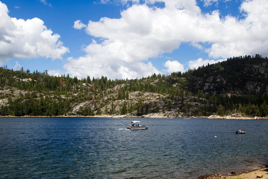 Boats On Pinecrest Lake California With White Clouds Blue Sky