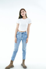 Fototapeta premium Cute and lively Asian girl against a white background