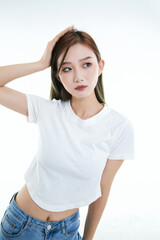 Fototapeta premium Cute and lively Asian girl against a white background