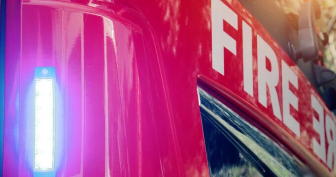 Fire truck emergency service vehicle with flashing lights. Red fire engine with ladders, firefighting apparatus and water to save lives, extinguish fires and assist vehicle collision.