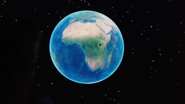Fingers rotate a virtual planet on a touchscreen, demonstrating gesture control, digital interaction and interactive astronomy education.