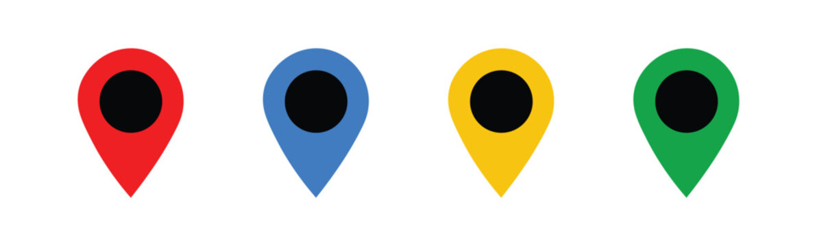 Colorful location pin icons. Map pin vector icon set in red, blue, yellow, and green with solid black centers.