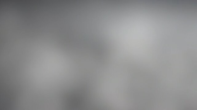Moving abstract blurred pale grey smoke background, slow calm gradient for focus and study