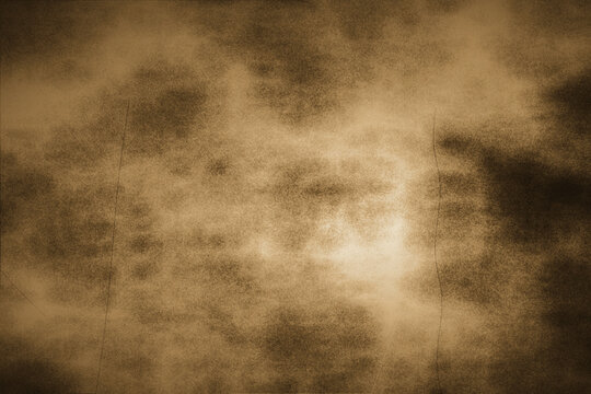 Abstract grunge background with vintage golden brown texture and subtle dark distressed scratches for professional graphic design and digital media art.