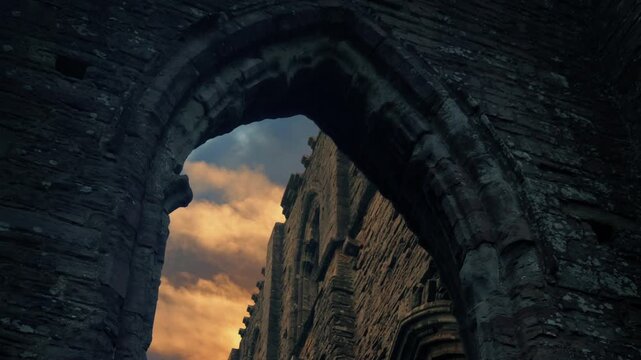 Sunset Over Medieval Abbey Seen Through Arch
