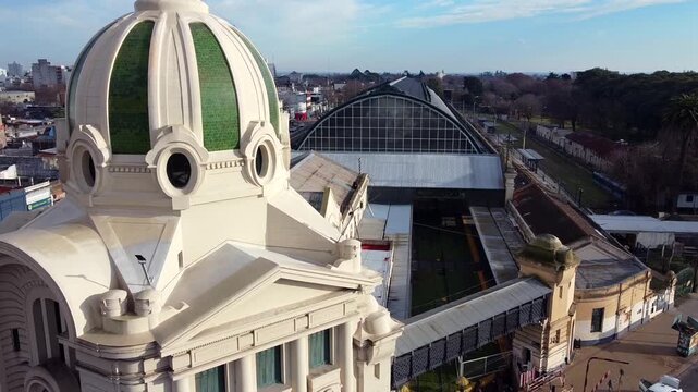 Dome of La Plata Train Station uncovering the university platform, overhead bridge, and glass train shed in Argentina.