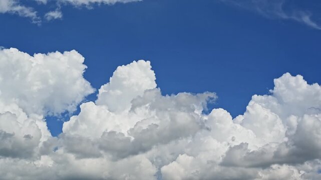 Timelapse Blue Sky with Fluffy White Cumulus Clouds and Bright Sunlight Creating a Peaceful Natural Cloudscape on a Clear Summer Day