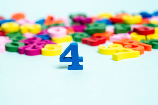 Blue number four surrounded by colorful numbers