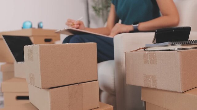 Portrait of Starting small businesses SME owners, two Asian woman check online orders Selling products working with boxs freelance work at home office, sme business online small medium enterprise