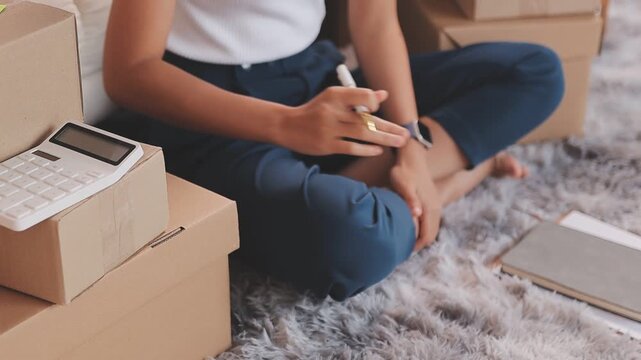 Portrait of Starting small businesses SME owners, two Asian woman check online orders Selling products working with boxs freelance work at home office, sme business online small medium enterprise