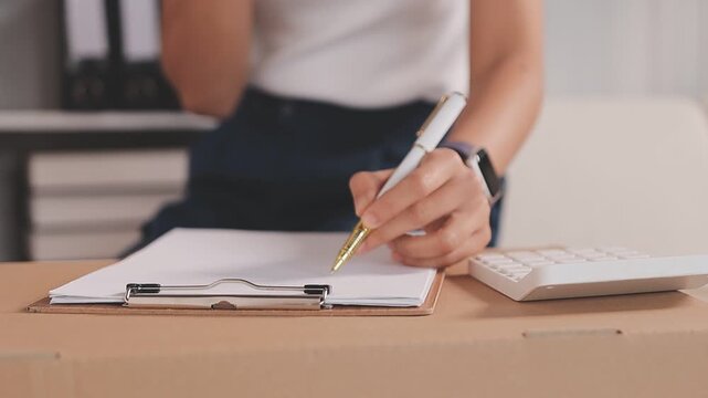Portrait of Starting small businesses SME owners, two Asian woman check online orders Selling products working with boxs freelance work at home office, sme business online small medium enterprise